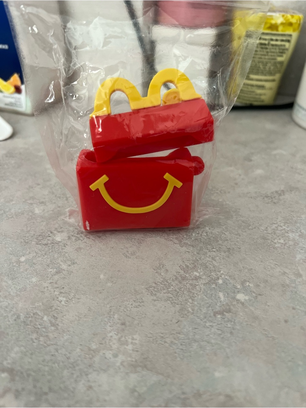 Red Smiley Toy Box with Yellow Handle